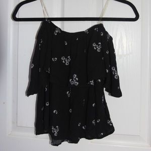 An off the shoulder floral top.